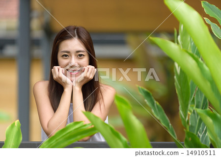 Woman putting hands on both side of her face 14910511