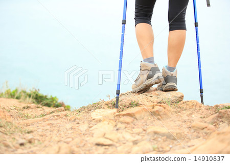 woman hiker hiking stand on seaside rock 14910837