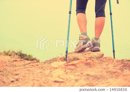woman hiker hiking stand on seaside rock woman hiker hiking stand on seaside rock 14910838
