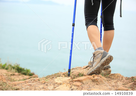 woman hiker hiking stand on seaside rock 14910839