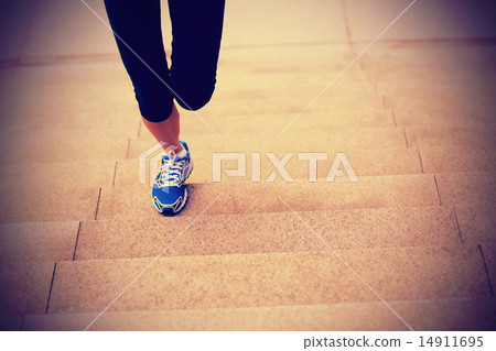 sports woman legs running up on stone stairs sports woman legs running up on stone stairs 14911695