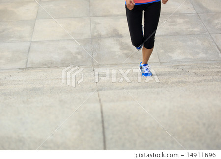 sports woman legs running up on stone stairs sports woman legs running up on stone stairs 14911696