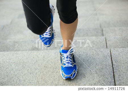 sports woman legs running up on stone stairs sports woman legs running up on stone stairs 14911726