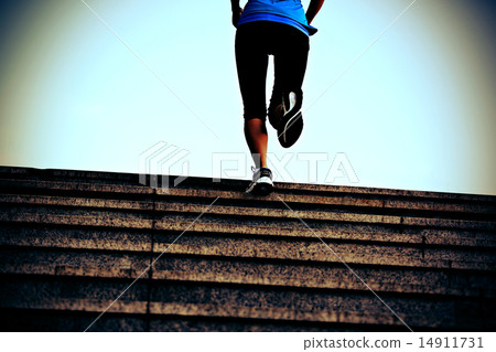 sports woman legs running up on stone stairs sports woman legs running up on stone stairs 14911731
