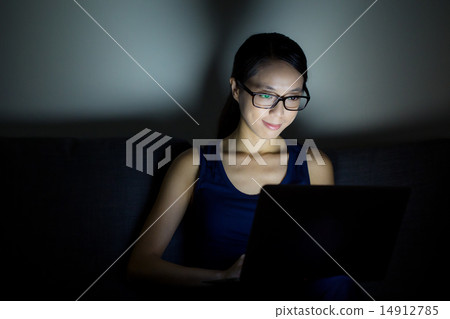 Woman use laptop computer at night 14912785