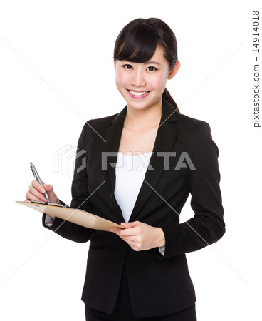 Young businesswoman write on clipboard Young businesswoman write on clipboard 14914018