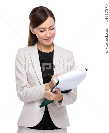 Businesswoman write on clipboard Businesswoman write on clipboard 14917570