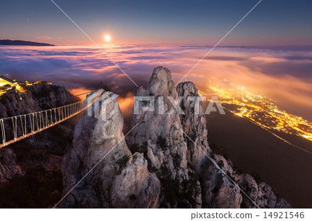 Beautiful night landscape with full moon, sea, rocks and clouds Beautiful night landscape with full moon, sea, rocks and clouds 14921546