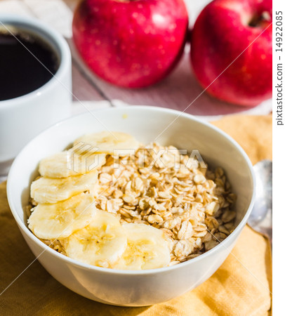 oatmeal with bananas, apples and a cup of coffee oatmeal with bananas, apples and a cup of coffee 14922085