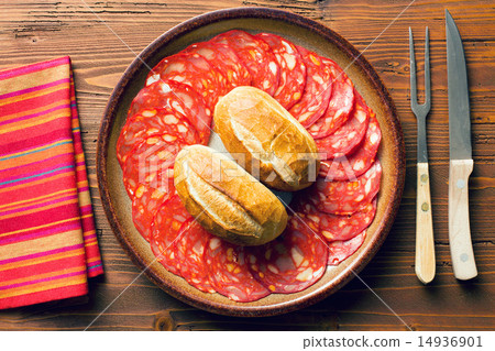 sliced chorizo salami on plate 14936901