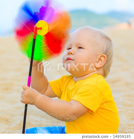 Baby with toy windmill 14939185
