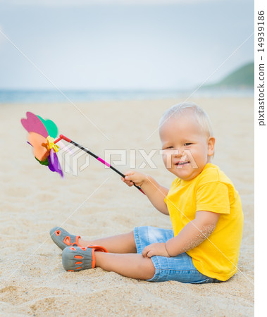 Baby with toy windmill 14939186