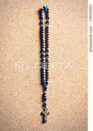 rosary beads on cork board 14939802