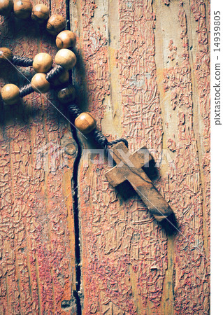 rosary on old wooden table 14939805