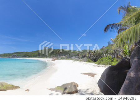 White coral sand on tropical beach. La Digue 14940295