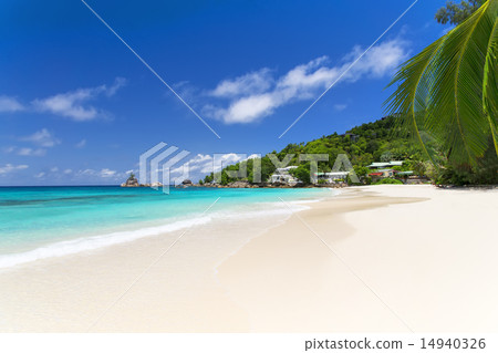 White coral beach sand and azure indian ocean. White coral beach sand and azure indian ocean. 14940326