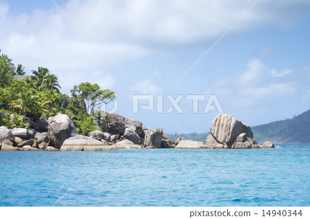 White coral sand on tropical beach. La Digue 14940344