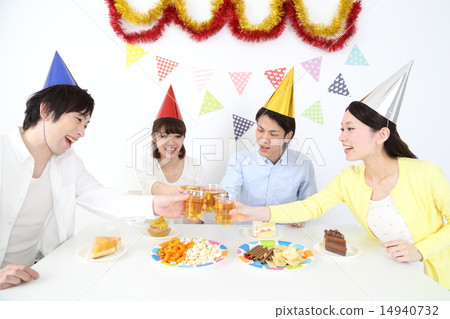 Young men and women toast at the party 14940732