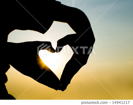 Silhouette hand in heart shape during sunset Silhouette hand in heart shape during sunset 14941217