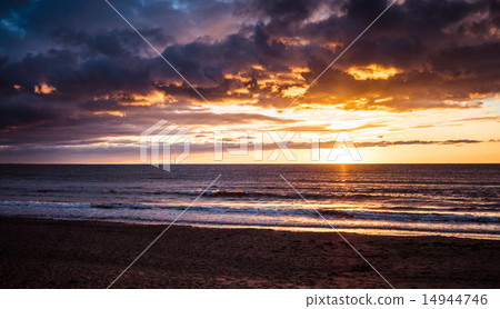 Bright sunset at the sea 14944746