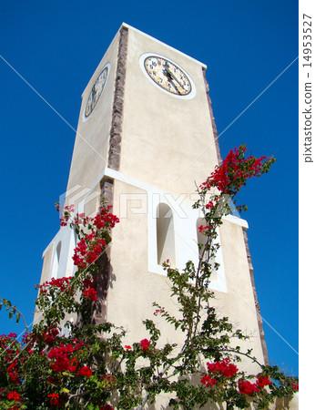 Clock tower surrounded by flowers and blue sky 14953527