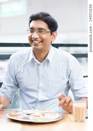 Happy man eating food at cafeteria. 14955836