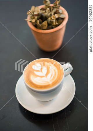 Cup of coffee on a wooden background 14962822