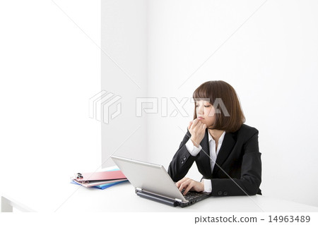 A woman in a business suit A woman in a business suit 14963489