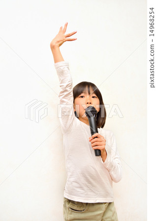 A girl singing with a microphone A girl singing with a microphone 14968254