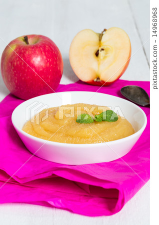 Applesauce on pink paper and spoon Applesauce on pink paper and spoon 14968968