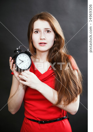 girl in red dress late with alarm clock girl in red dress late with alarm clock 14969306