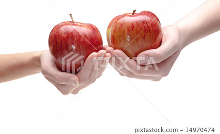 Two hands give each other an apple Two hands give each other an apple 14970474