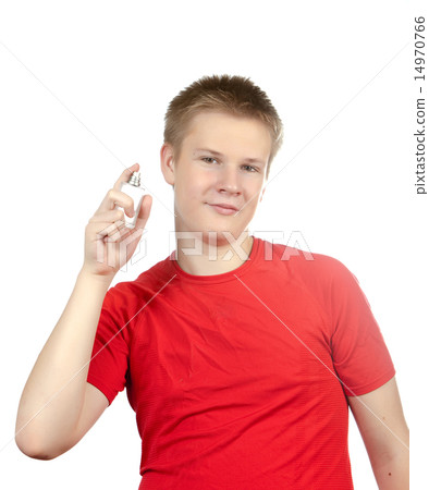 boy, the teenager spraying fragrance perfume.. 14970766