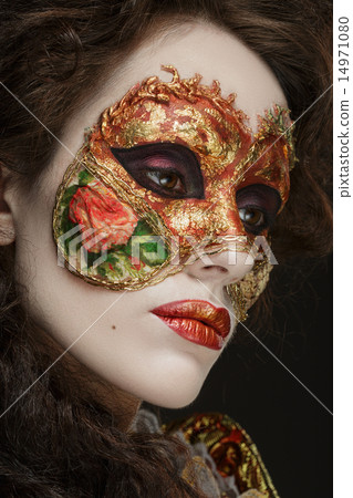 Close-up portrait of Beautiful woman in vintage dress and a mask Close-up portrait of Beautiful woman in vintage dress and a mask 14971080
