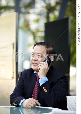 Asian businessman using smart phone Asian businessman using smart phone 14972732