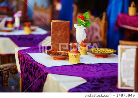 Table in Moroccan street restaurant Table in Moroccan street restaurant 14973949