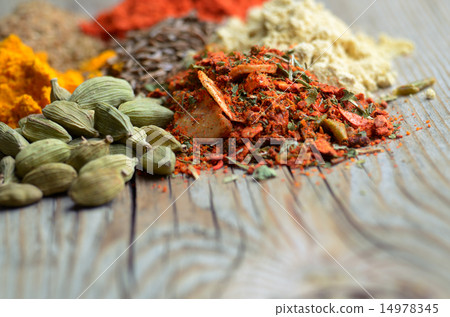 Assorted spices and dry herbs on wooden background 14978345