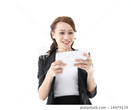 Woman looking reading in tablet pc Woman looking reading in tablet pc 14979179