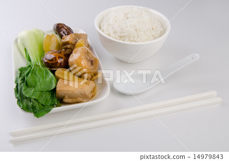 Chicken with rice and vegetables in background 14979843