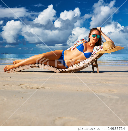 Woman in bikini lying on beach at Seychelles Woman in bikini lying on beach at Seychelles 14982714