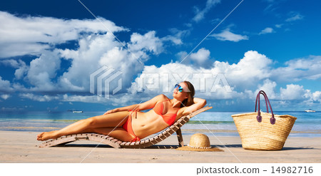 Woman in bikini lying on beach at Seychelles Woman in bikini lying on beach at Seychelles 14982716