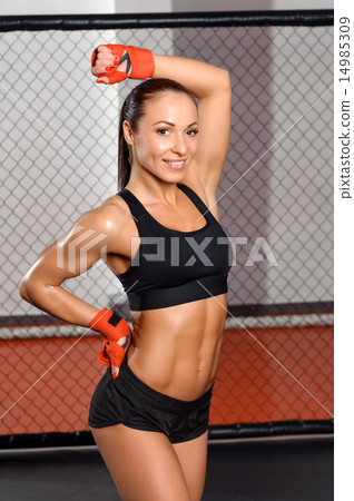 Female fighter in a cage Female fighter in a cage 14985309