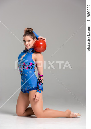 teenager doing gymnastics dance with red gymnastic ball teenager doing gymnastics dance with red gymnastic ball 14986922