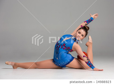 teenager doing gymnastics exercises with red gymnastic ball 14986923