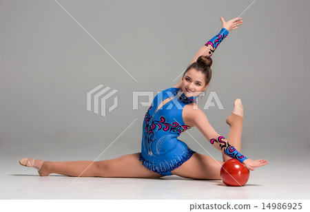 teenager doing gymnastics exercises with red gymnastic ball 14986925