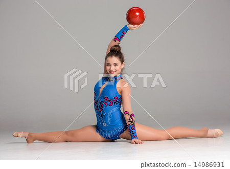 teenager doing gymnastics exercises with red gymnastic ball teenager doing gymnastics exercises with red gymnastic ball 14986931
