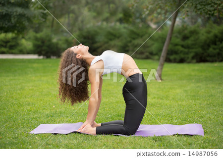 Pretty woman doing yoga exercises Pretty woman doing yoga exercises 14987056