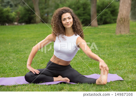 Pretty woman doing yoga exercises Pretty woman doing yoga exercises 14987108