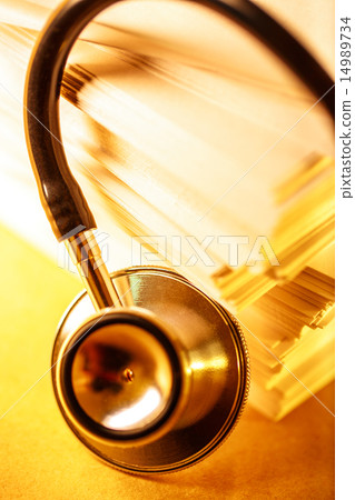 Stethoscope and heap of paper cards Stethoscope and heap of paper cards 14989734