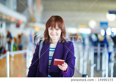 Beautiful young passenger at check-in counter Beautiful young passenger at check-in counter 14990155